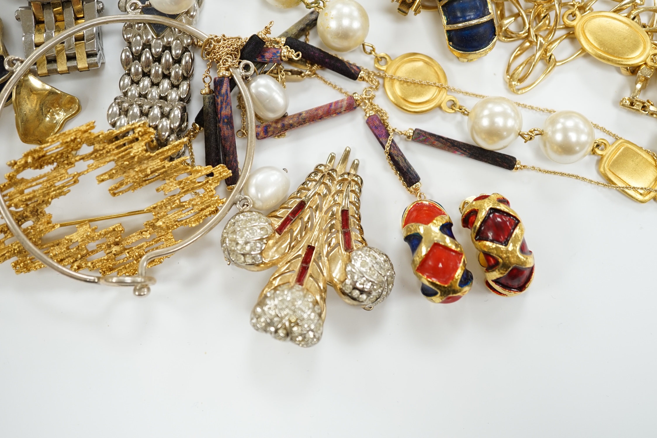 Two Christian Dior necklaces and three pairs of Dior ear clips, together with other signed pieces of costume jewellery.